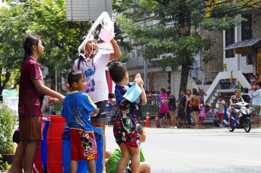 BANGKOK - APRIL 14 2012: Songkran (thai new year / water festival) is celebrated from april 13 to 15. people roam the streets and drench each other and passersby with water