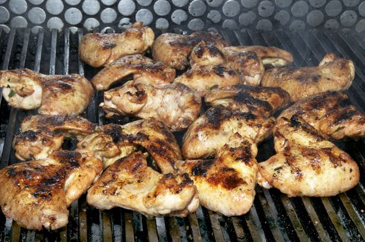 Grilled chicken wings are cooked in the restaurant