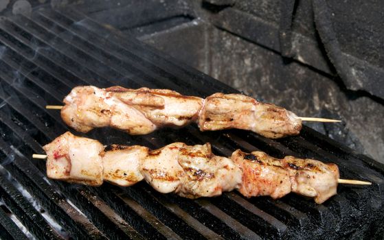 Chicken kebabs on the grill in the restaurant