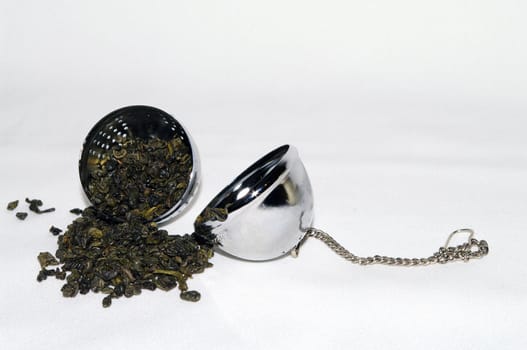 Green Tea in a tea infuser ball
