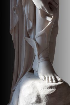 Marble statue of Talaria (winged sandals) of greek god Hermes