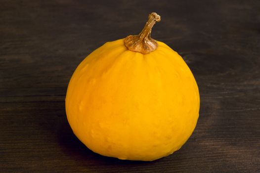 Decorative pumpkin on wooden blackboard