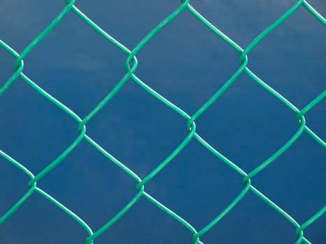 close up of green wire fence