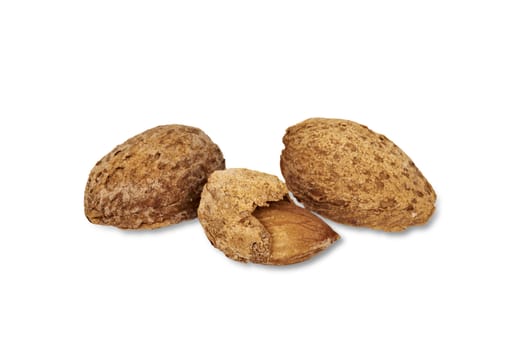 Closeup view of almond nuts in their shells, isolated on white background with light shadow. 

