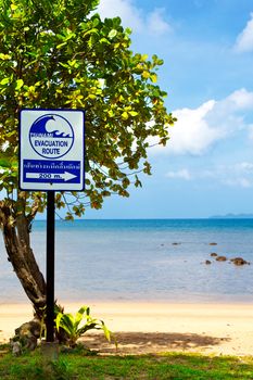 tsunami evacuation route sign on a beach, Thailand