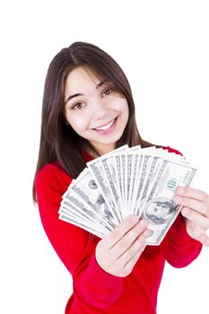 Slim sweet looking girl wishing more money with money in her hands. In red catchy sweter, isolated on white background.
