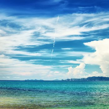 sunny beach and islands on horizon, Thailand