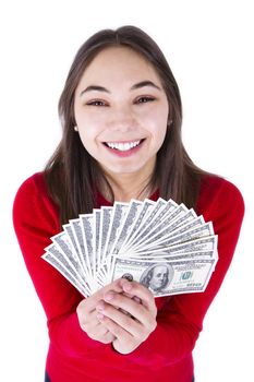 Teenager thrilled with money, holding big bucks in her hands happily, all one hundred dollar banknotes. Isolated on white background.