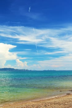 sunny beach and islands on horizon, Thailand