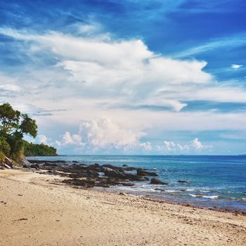 sunny beach with rocks and jungle, Thailand