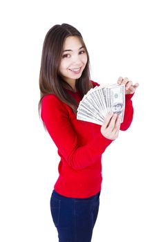 Young woman holding all one hundred dollar banknotes. Slim girl in red catchy sweter and jeans, isolated on white background.