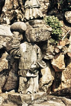 stone statue in Wat Pho, Bangkok, Thailand