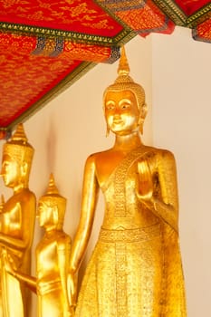 golden statue in Wat Po, Bangkok, Thailand