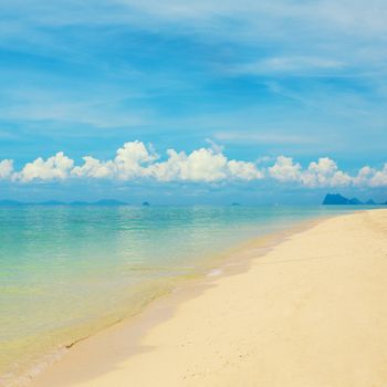 sunny beach and islands on horizon, Thailand