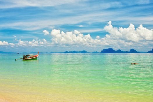 sunny beach and thai traditional boat, Thailand