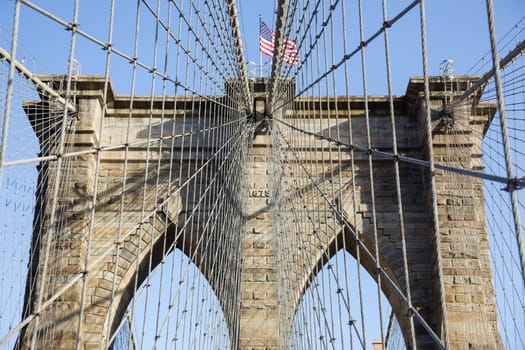 Detail of cables and wires on pier of Brooklyn Bridge in New York