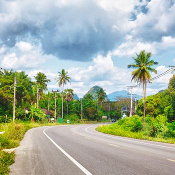 asphalt highway in jungle wit mount, Krabi, Thailand