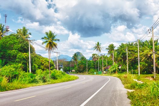 asphalt highway in jungle wit mount, Krabi, Thailand