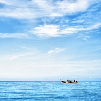 seascape with boat and rocks, Andaman Sea, Thailand