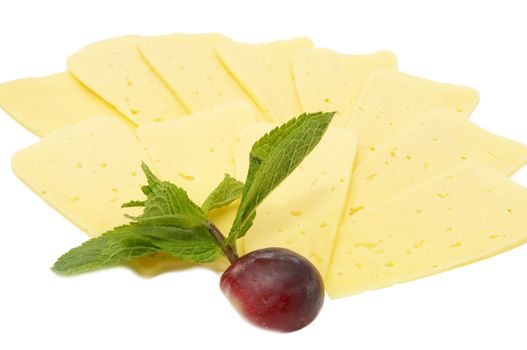 cheese on a white background decorated with mint and radish