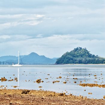 yacht in sea at low tide, Thailand