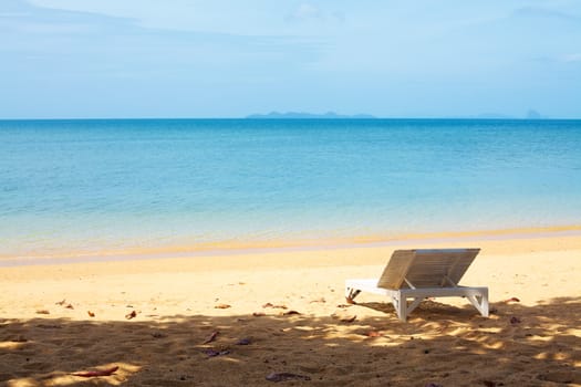 chaise lounge on a beach at summer day