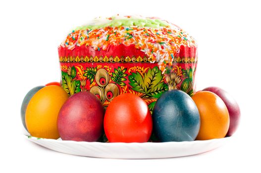 Easter eggs and cake on big plate, all is isolated on white