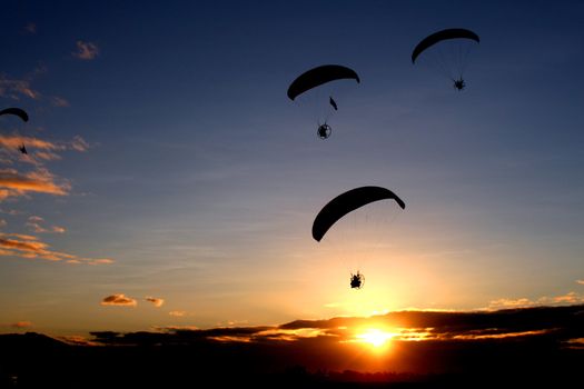 An early morning paragliding by the participants of the Annual Hot Air Balloon Fiesta in Angeles, Pampangga, Philippines.