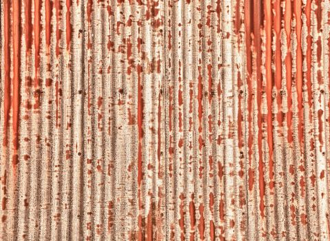 Close up of a sheet of corrugated metal rusting and processed in HDR