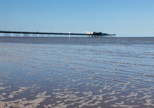 Unusual combination of high tide floods the beach at Southport