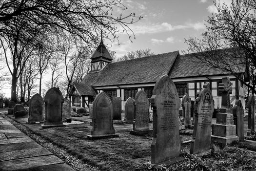 Graveyard and half timbered church of Great Altcar near Southport in England