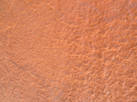 section of an orange textured surface