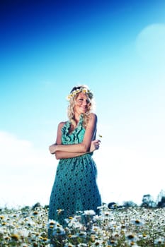 beautiful girl  in dress on the daisy flowers field 