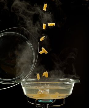pasta is falling into a boiled water