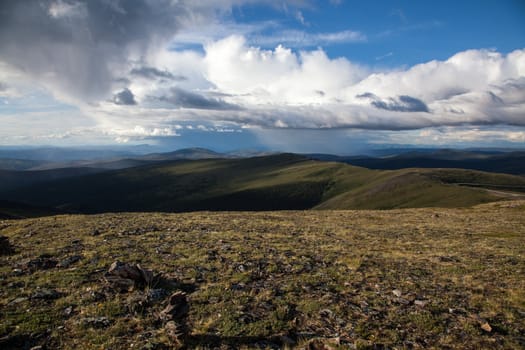 Rain storms hang over the high alpine tundra