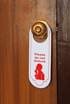 Please do not disturb hotel tag hanging on door