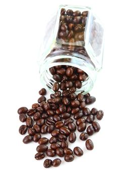 Coffee beans in a glass jar on white background