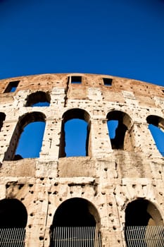 Colosseum in Rome with blue sky, landmark of the city