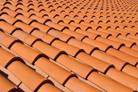 Orange roof tiles made from a ceramic material