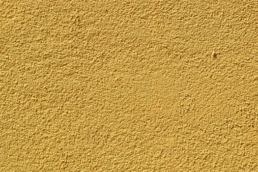 A yellow plaster wall texture / background.