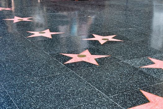 Stars in the sidewalk along the Hollywood walk of fame