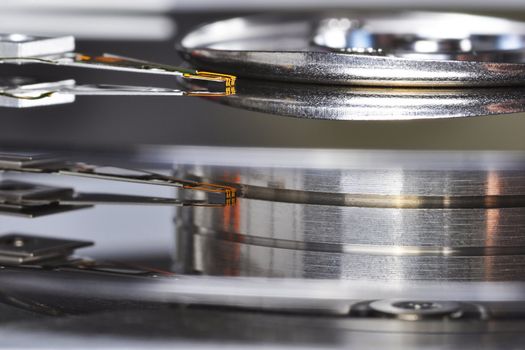 A close-up of an hard disk drive head, seen from the side