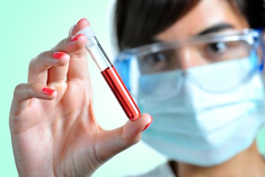 Women looking at a blood sample