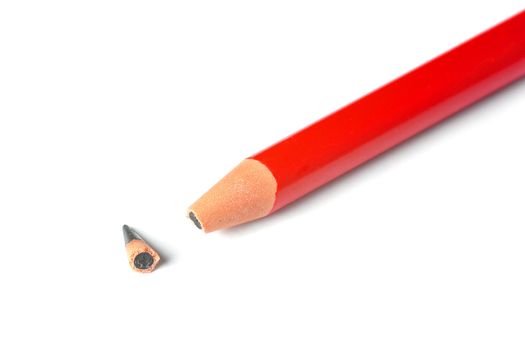 A broken pencil on a white piece of paper