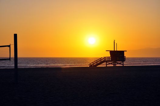 Lifeguard tower with sunset in California