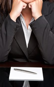 Bored businesswoman sitting at a table