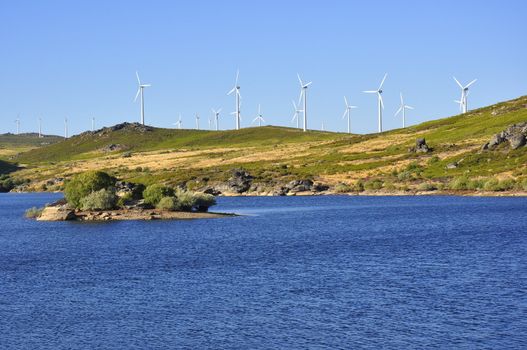 Wind Turbines next to a river