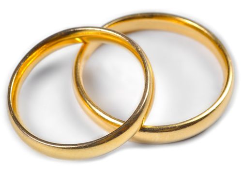 Two wedding rings on a white background.
