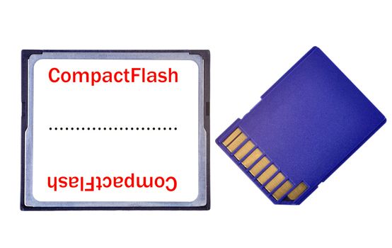A Compact Flash and a SD Card side by side, isolated in white