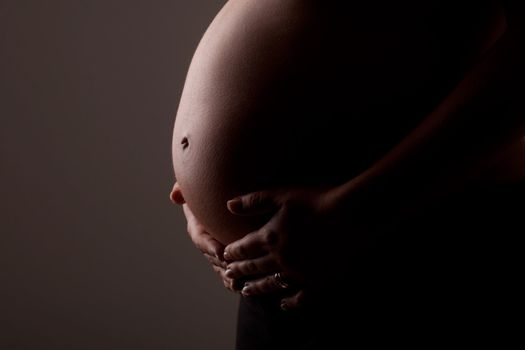 Closeup of a pregnant woman's belly
